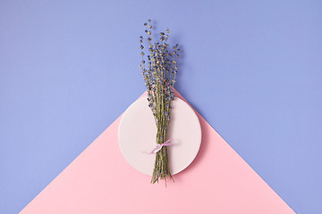 Image showing Branch of lavender on a round plate.