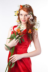 Image showing Portrait of beautiful woman with spring flowers