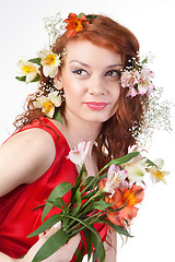 Image showing Portrait of beautiful woman with spring flowers