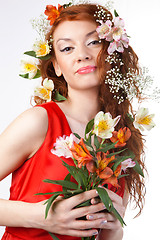 Image showing Portrait of beautiful woman with spring flowers