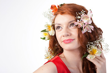 Image showing Portrait of beautiful woman with spring flowers on white