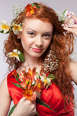 Image showing Portrait of beautiful woman with spring flowers 