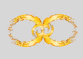 Image showing Splashing beer waves in the form of infinity symbol.