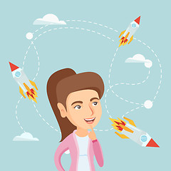 Image showing Caucasian business woman looking at flying rockets