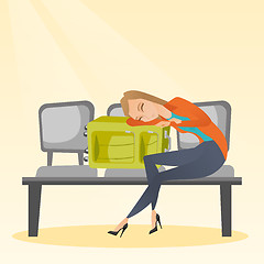 Image showing Tired woman sleeping on suitcase at the airport.