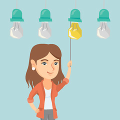 Image showing Business woman switching on hanging idea bulb.