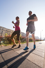 Image showing young couple jogging  in the city