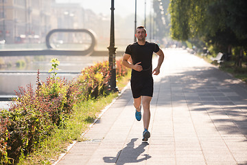 Image showing man jogging at sunny morning