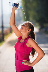 Image showing woman pouring water from bottle on her head