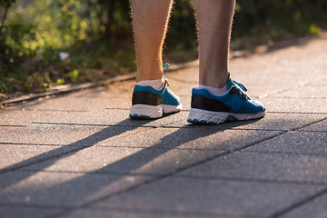 Image showing woman jogging at sunny morning