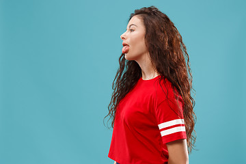 Image showing Beautiful woman in stress isolated on blue