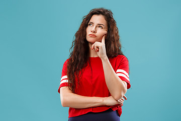 Image showing Young serious thoughtful business woman. Doubt concept.