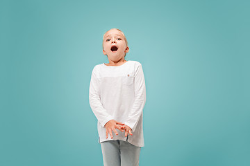 Image showing Portrait of the scared girl on blue