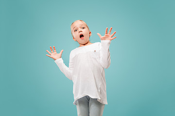 Image showing Portrait of the scared girl on blue