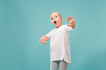 Image showing Portrait of the scared girl on blue