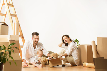 Image showing Couple moving to a new home - Happy married people buy a new apartment to start new life together