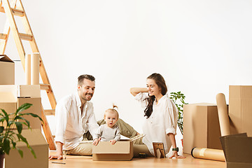 Image showing Couple moving to a new home - Happy married people buy a new apartment to start new life together