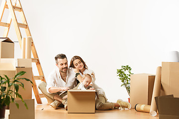 Image showing Couple moving to a new home - Happy married people buy a new apartment to start new life together