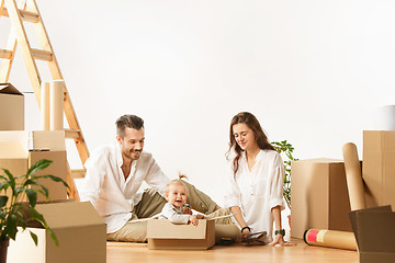 Image showing Couple moving to a new home - Happy married people buy a new apartment to start new life together