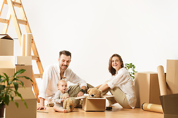 Image showing Couple moving to a new home - Happy married people buy a new apartment to start new life together