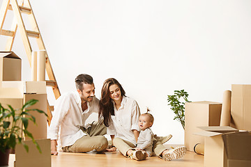 Image showing Couple moving to a new home - Happy married people buy a new apartment to start new life together