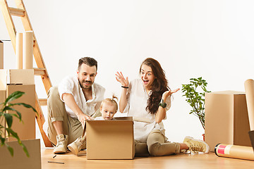 Image showing Couple moving to a new home - Happy married people buy a new apartment to start new life together