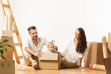 Image showing Couple moving to a new home - Happy married people buy a new apartment to start new life together