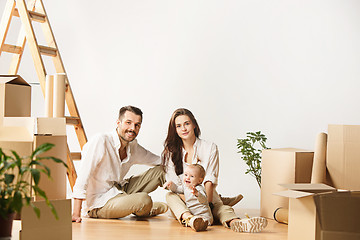 Image showing Couple moving to a new home - Happy married people buy a new apartment to start new life together