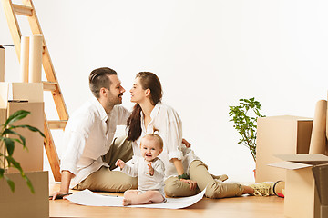 Image showing Couple moving to a new home - Happy married people buy a new apartment to start new life together