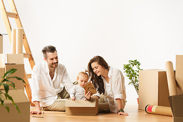 Image showing Couple moving to a new home - Happy married people buy a new apartment to start new life together