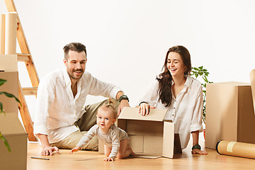 Image showing Couple moving to a new home - Happy married people buy a new apartment to start new life together