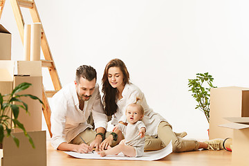 Image showing Couple moving to a new home - Happy married people buy a new apartment to start new life together