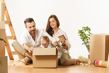 Image showing Couple moving to a new home - Happy married people buy a new apartment to start new life together