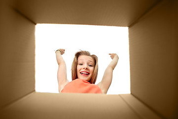 Image showing happy girl looking into open gift box