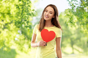 Image showing smiling teenage girl with red heart