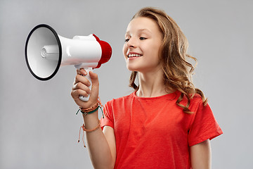 Image showing happy teenage girl speaking to megaphone