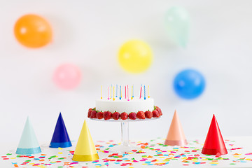 Image showing birthday cake with candles and strawberries