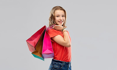 Image showing smiling teenage girl with shopping bags