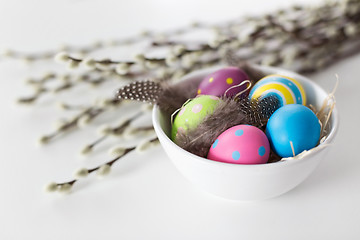 Image showing colored easter eggs and pussy willow branches