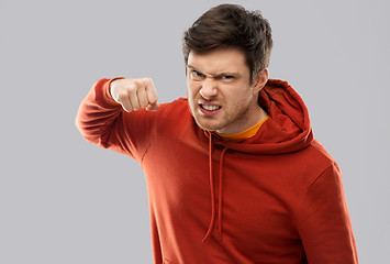 Image showing angry young man ready for fist punch
