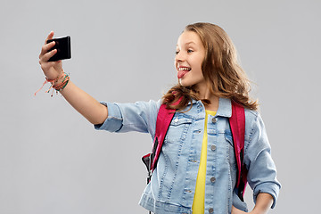 Image showing teenage student girl taking selfie by smartphone