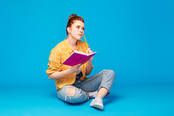 Image showing teenage student girl with diary or notebook