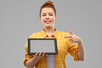 Image showing red haired teenage girl showing tablet computer