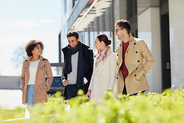 Image showing office workers or friends talking on city street