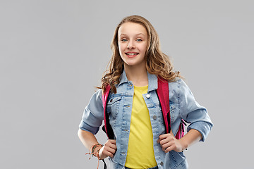 Image showing happy smiling teenage student girl with school bag