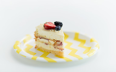 Image showing piece of berry layer cake on disposable plate