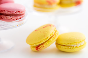 Image showing close up of yellow and pink macarons