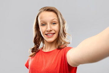 Image showing smiling teenage girl taking selfie