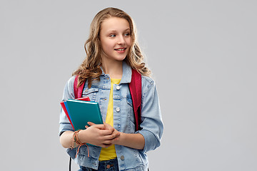 Image showing happy smiling teenage student girl with school bag