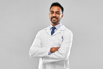 Image showing smiling male doctor or scientist in white coat